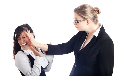 Two young women conflict, isolated on white background.の写真素材