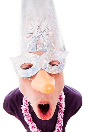 Funny man wearing party mask, isolated on white background.の写真素材