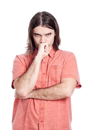 Young longhaired pensive man thinking, isolated on white background.の写真素材