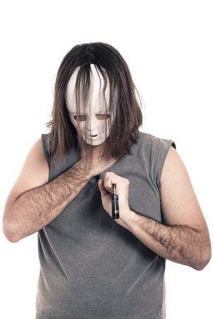 Scary horror dying man stabbed with knife, isolated on white background.の写真素材