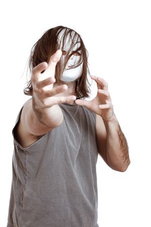 Insane horror masked man gesturing, isolated on white background.の写真素材