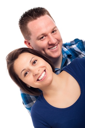 Portrait of young happy couple, isolated on white background.の写真素材