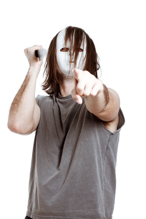 Scary killer horror man with knife, pointing at you, isolated on white background.の写真素材
