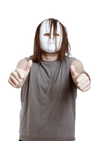 Horror scary masked man gesturing thumbs up, isolated on white background.の写真素材