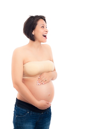 Happy excited beautiful pregnant woman, isolated on white background.の写真素材