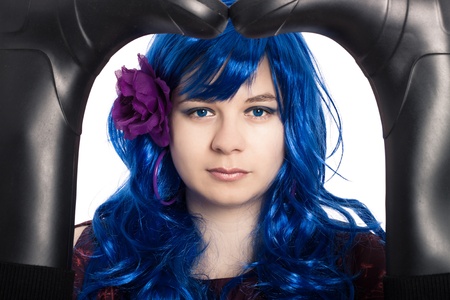 Abstract creative portrait of mysterious woman in blue wig.の写真素材