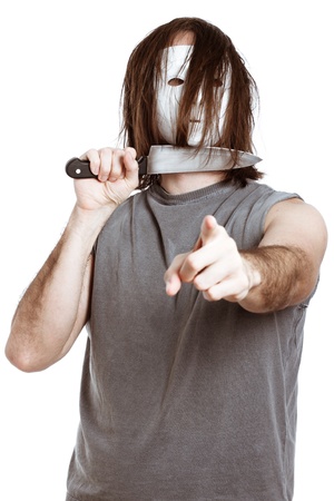 Scary horror man with knife, pointing at you, isolated on white background.の写真素材