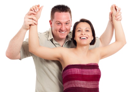 Portrait of young happy smiling couple, isolated on white background.の写真素材