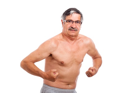 Naked senior man posing and showing his muscles, isolated on white background.の写真素材