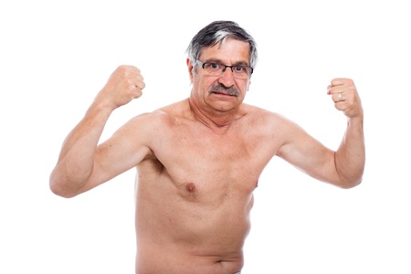 Naked senior man posing and showing his strong body, isolated on white background.の写真素材