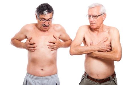 Two naked senior men exploring their body, isolated on white background.の写真素材