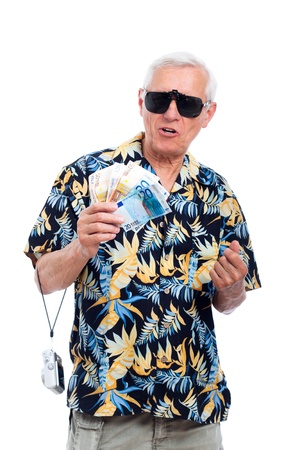 Rich senior tourist holding money and camera, isolated on white background.の写真素材