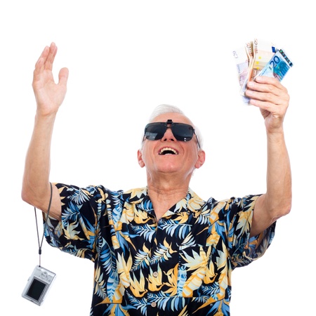 Satisfied happy rich senior man with money, isolated on white background.の写真素材
