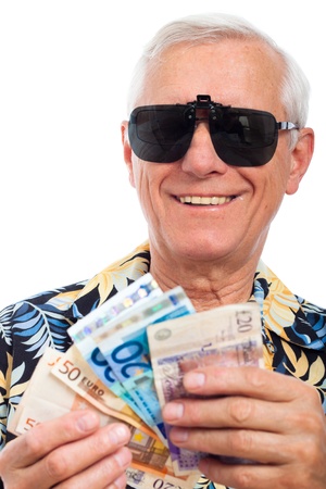 Happy rich elderly man with money, isolated on white background.の写真素材
