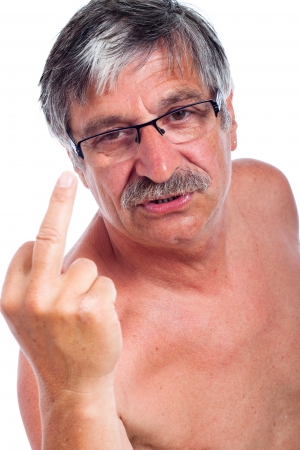Close up of angry middle aged man rude gesturing, isolated on white background.の写真素材