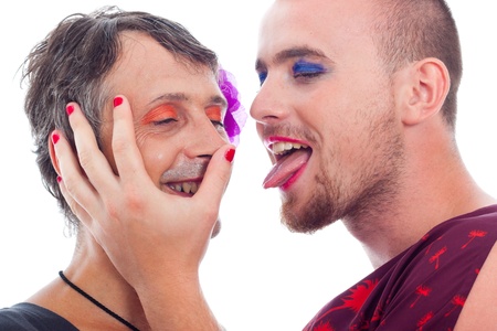 Close up of two funny transvestites flirting, isolated on white background.の写真素材