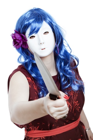 Scary horror masked woman assaulting with knife, isolated on white background.の写真素材