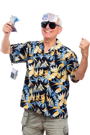 Happy wealthy senior man holding money and camera, isolated on white background.の写真素材