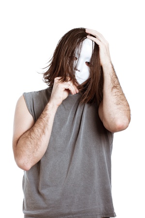 Bizarre horror masked man, isolated on white background.の写真素材