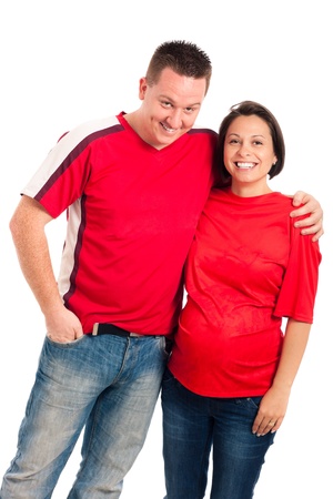 Portrait of young smiling pregnant couple, isolated on white background.の写真素材