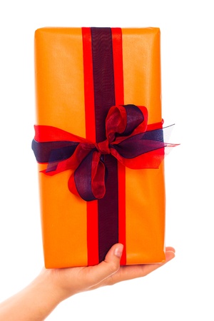 Close up of a hand holding gift box, isolated on white background.の写真素材