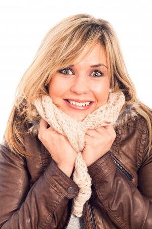 Close up of young ecstatic woman in winter leather jacket, isolated on white background.の写真素材