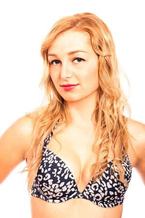 Close up of young beautiful blond woman in bikini, isolated on white background.の写真素材