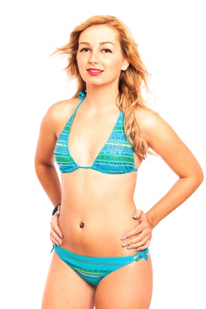 Portrait of young attractive woman in blue bikini, isolated on white background.の写真素材