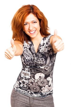 Ecstatic happy woman gesturing thumbs up, isolated on white background.の写真素材