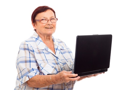 Portrait of happy senior woman holding laptop, isolated on white background.の写真素材