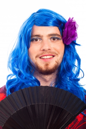 Happy transvestite man cross dressing in blue wig, isolated on white background.の写真素材