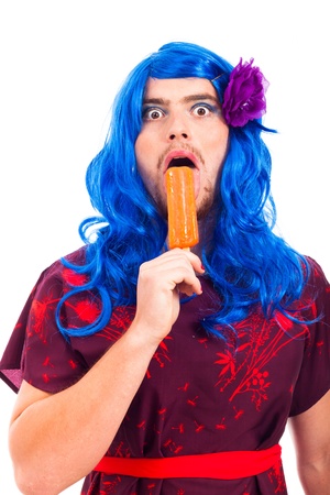 Bizarre transvestite licking ice pop, isolated on white background.の写真素材