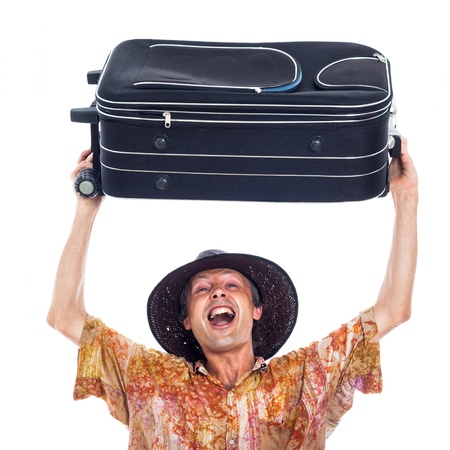 Ecstatic happy man travelling with luggage, isolated on white background.の写真素材