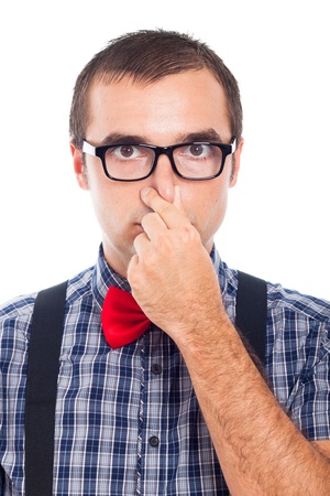 Close up of funny nerd man holding his nose, isolated on white background.の写真素材