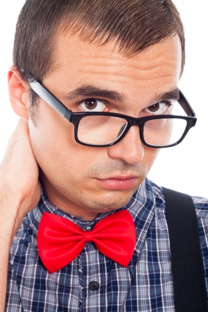 Close up of serious worried nerd man in eyeglasses, isolated on white background.の写真素材