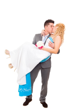 Just married wedding couple in love kissing, isolated on white backgroundの写真素材