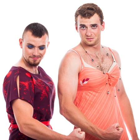 Two transvestites showing muscles, isolated on white background.の写真素材