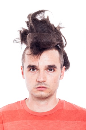 Portrait of a man with crazy haircut, isolated on white backgroundの写真素材