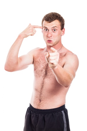 Mad shirtless man gesturing and pointing at you, isolated on white backgroundの写真素材