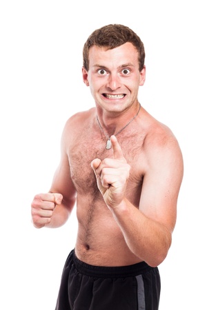 Mad shirtless man showing fist and pointing at you, isolated on white backgroundの写真素材