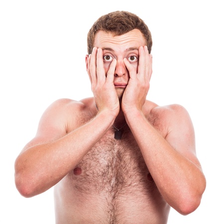 Sad shirtless man holding his face, isolated on white backgroundの写真素材