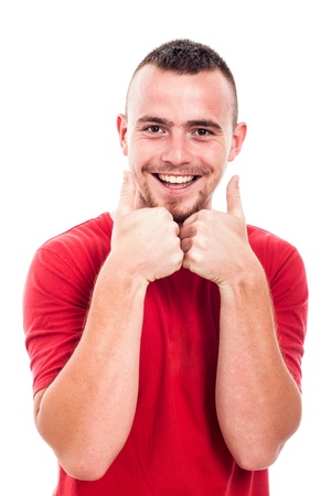 Young happy man showing thumbs up, isolated on white backgroundの写真素材