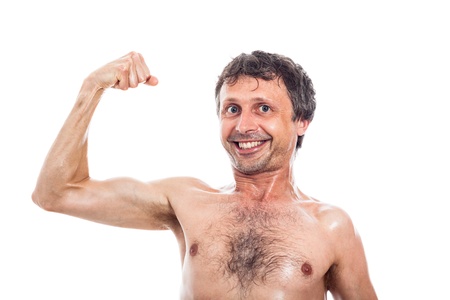 Funny shirtless man showing his biceps, isolated on white backgroundの写真素材