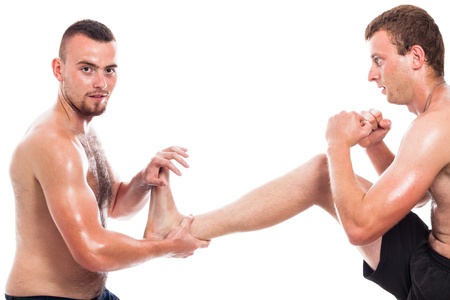 Two shirtless fighters training martial arts, isolated on white backgroundの写真素材