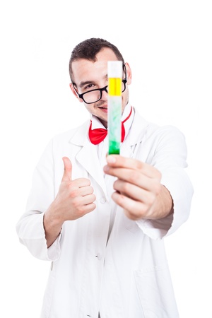 Happy scientist in lab coat holding test tube and showing thumb up, isolated on white backgroundの写真素材