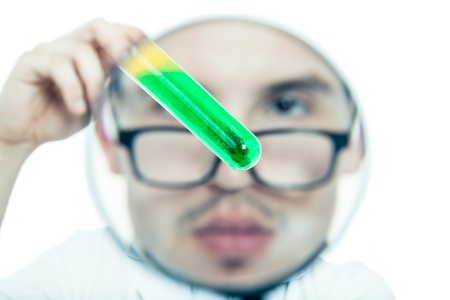 Scientist face through magnifying glass exploring test tube, isolated on white backgroundの写真素材