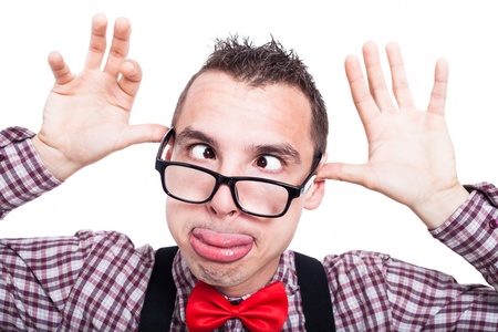 Silly cross-eyed nerd man making funny face, isolated on white backgroundの写真素材