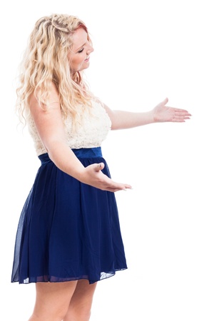 Young blond cheerful woman greeting, isolated on white backgroundの写真素材