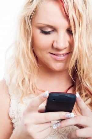 Closeup of beautiful blond woman with mobile phoneの写真素材