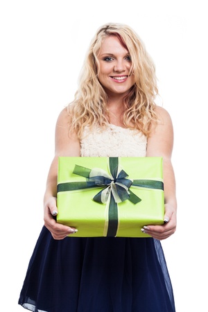 Portrait of beautiful cheerful woman holding green gift box, isolated on white backgroundの写真素材